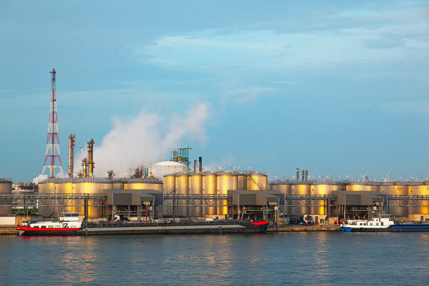 Industrial chemical storage tanks at a port facility